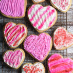 Heart shaped sugar cookies with pin frosting and sprinkles