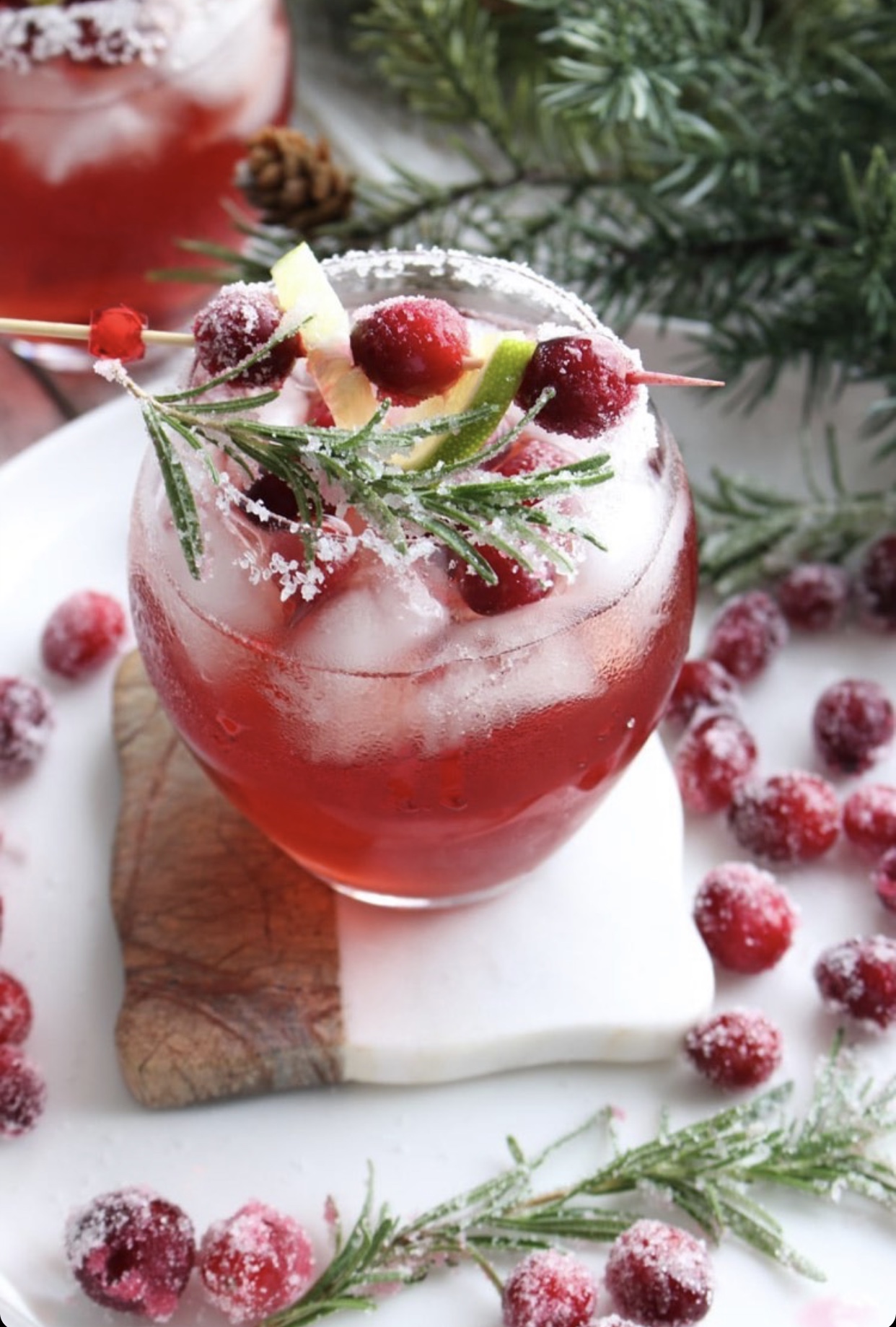pink margarita with cranberries and rosemary