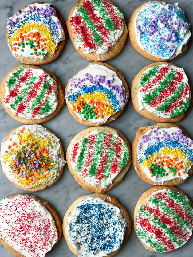 A variety of sugar cookies with vanilla frosting and sprinkles