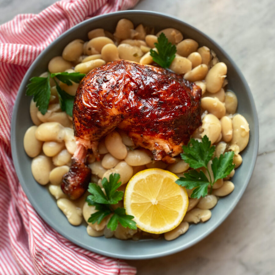 beer can smoked chicken with beans and a lemon