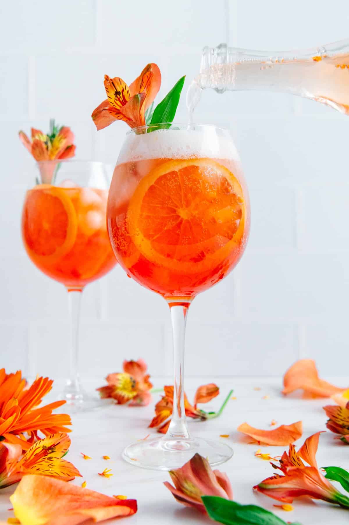 2 Aperol Sparkling Rose Spritzers and flowers