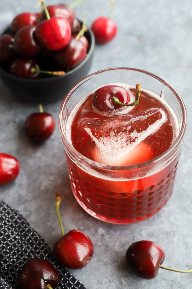 amaretto cherry sour in a glass with cherries