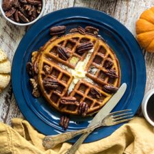 pumpkin spice waffles with butter and maple syrup