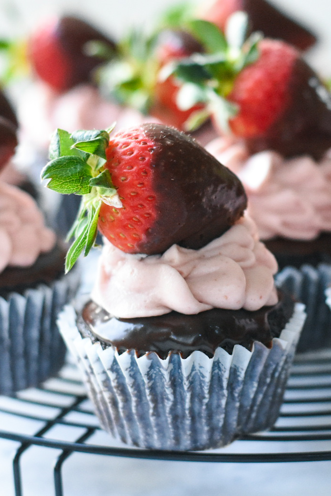 Chocolate covered strawberry topped chocolate cupcake
