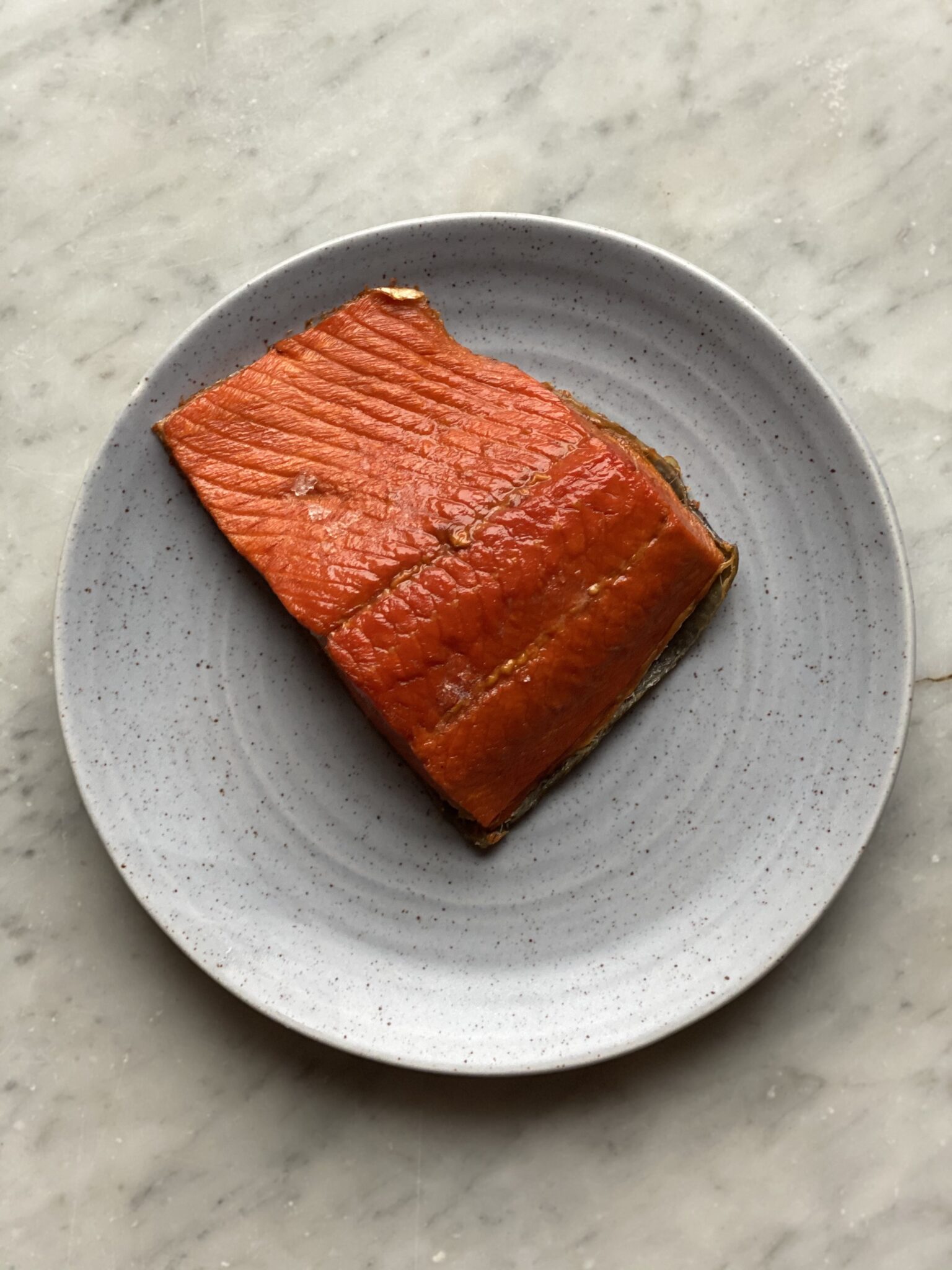 A piece of smoked salmon on a plate