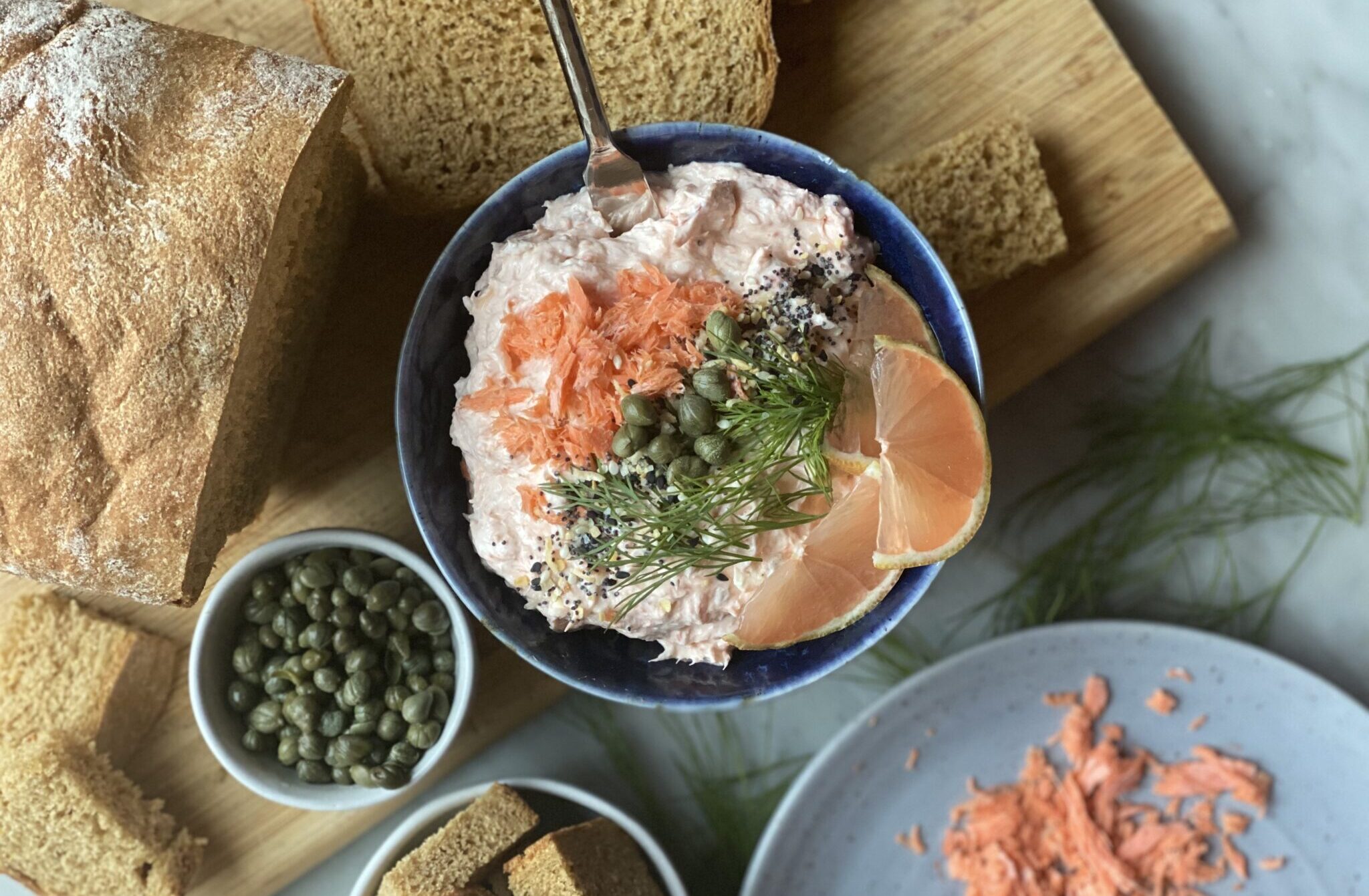 Smoked salmon spread with pink lemons and capers and bread
