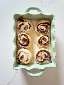 cinnamon rolls raised and covered with cream