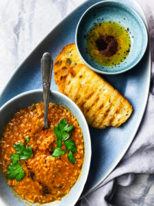 Redi lentil soup with grilled bread and toasted Aleppo pepper olive oil