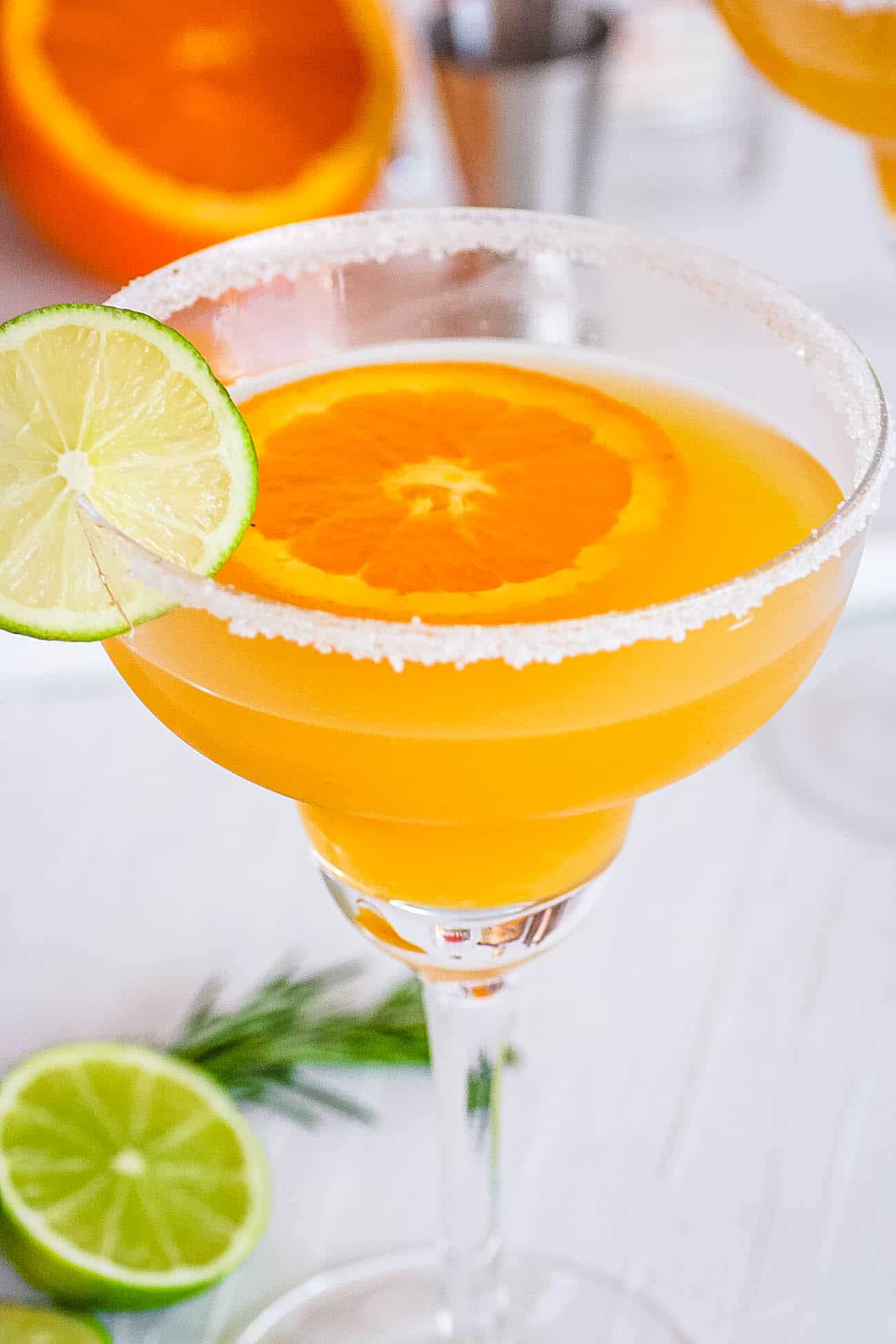Italian margarita in a glass with orange and lime