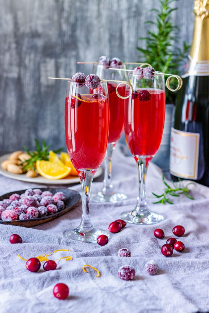 poinsettia cocktails with cranberry garnish