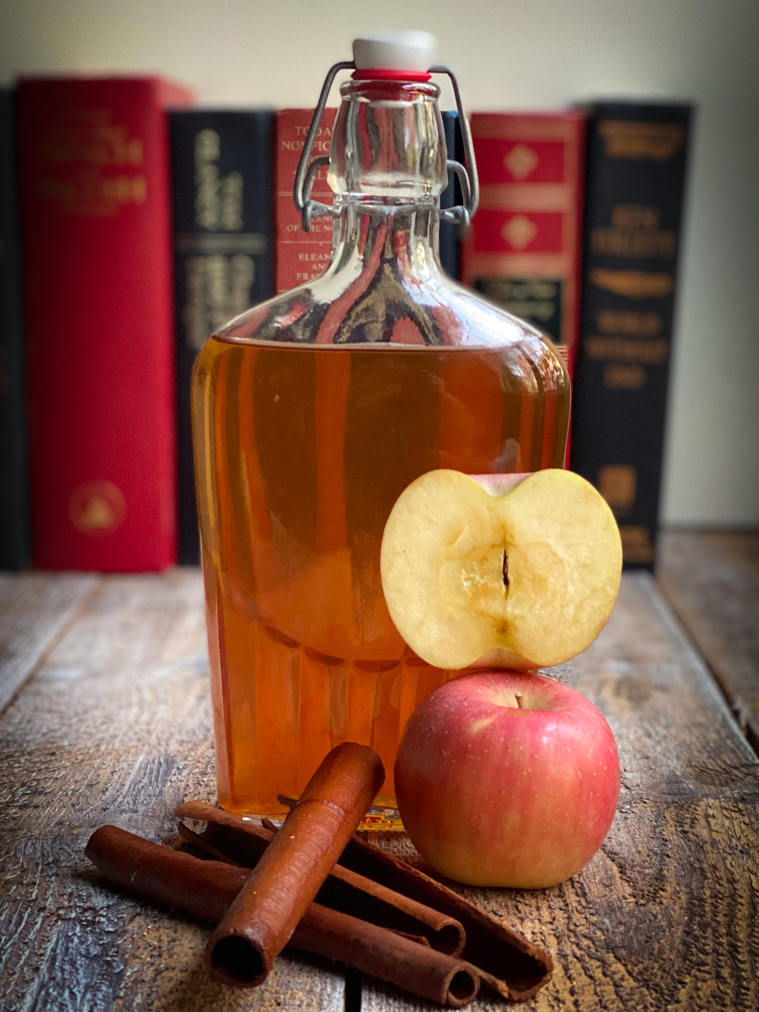 Apple cinnamon bourbon with an apple stacked and cinnamon stocks