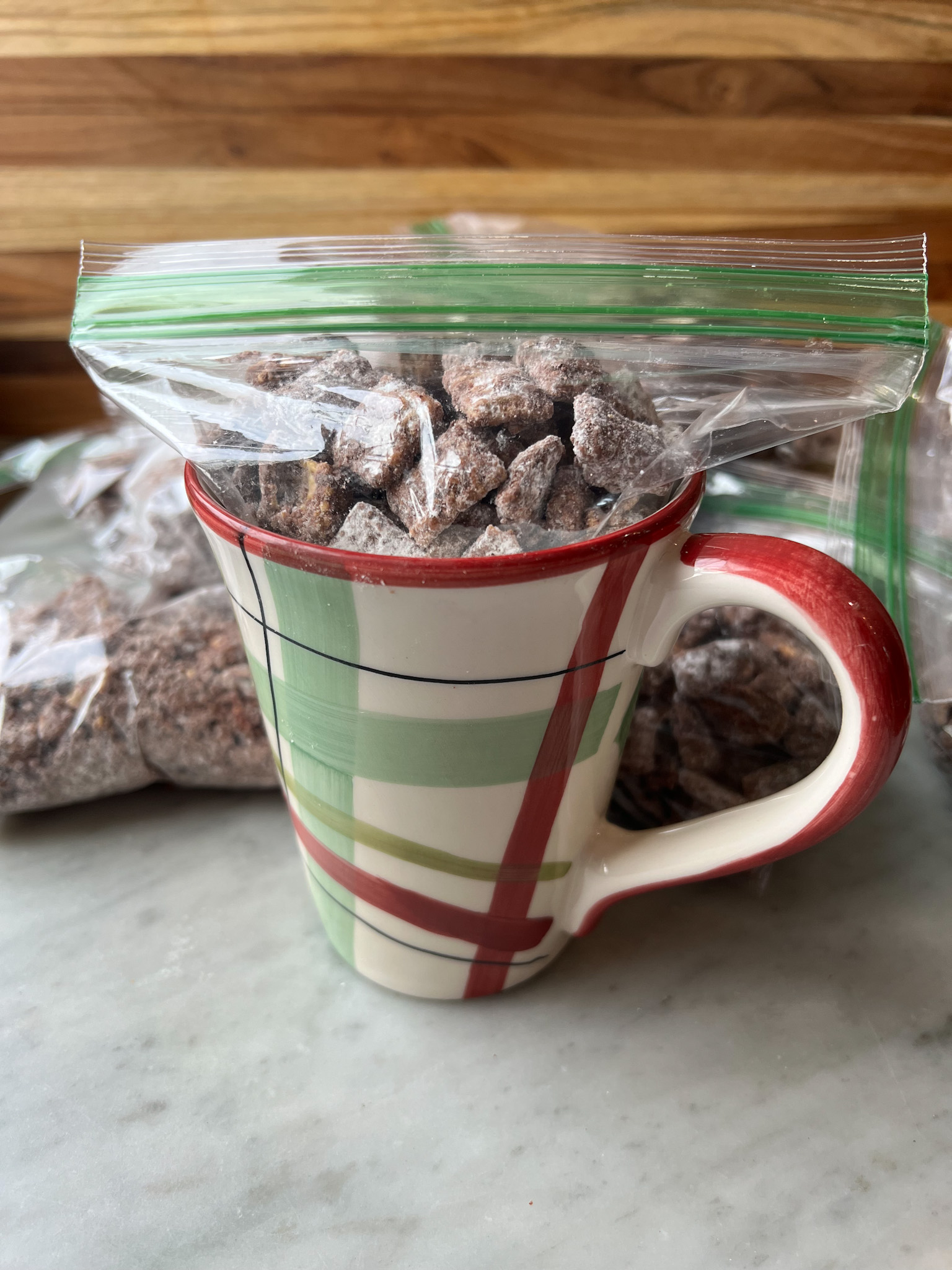 puppy chow in a bag in a holiday mug for a gift