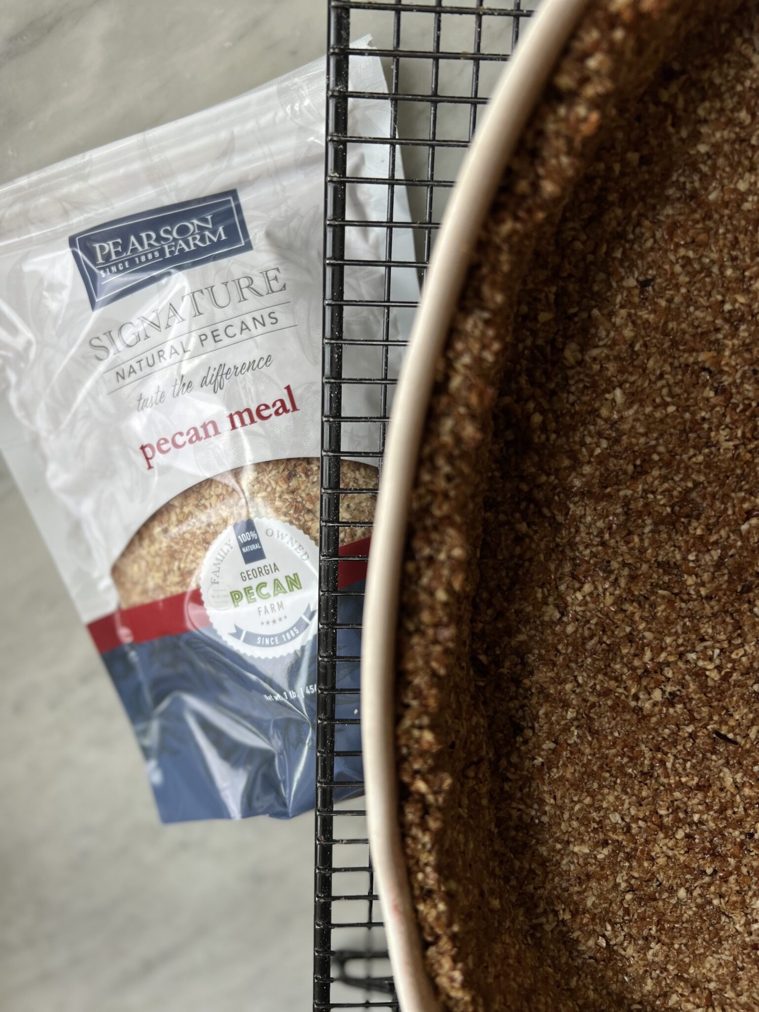 bag of Pearson Farm pecan meal and a pan with crust in it