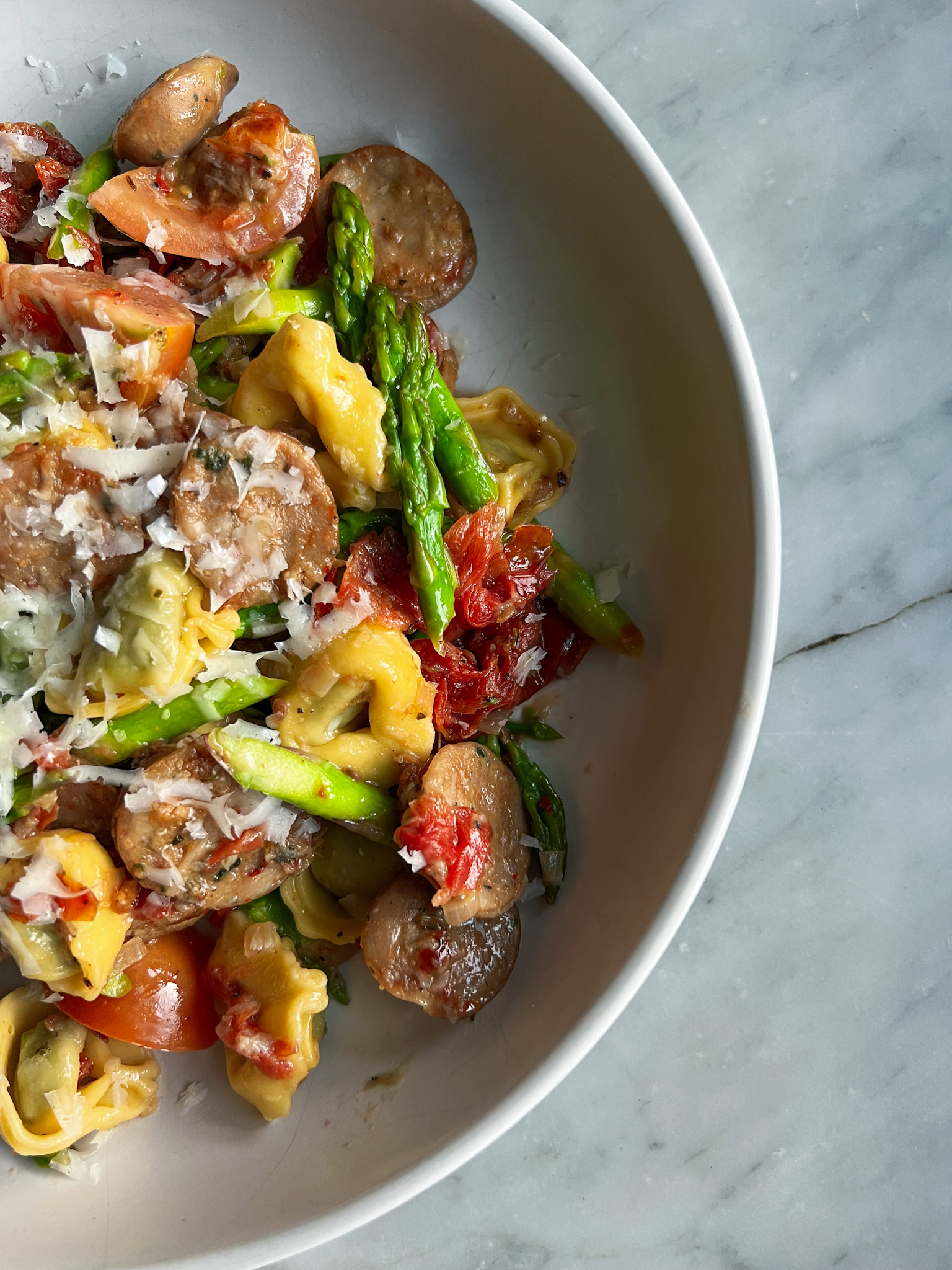 Trader Joes Chicken Sausage and tortellini with asparagus and tomatoes