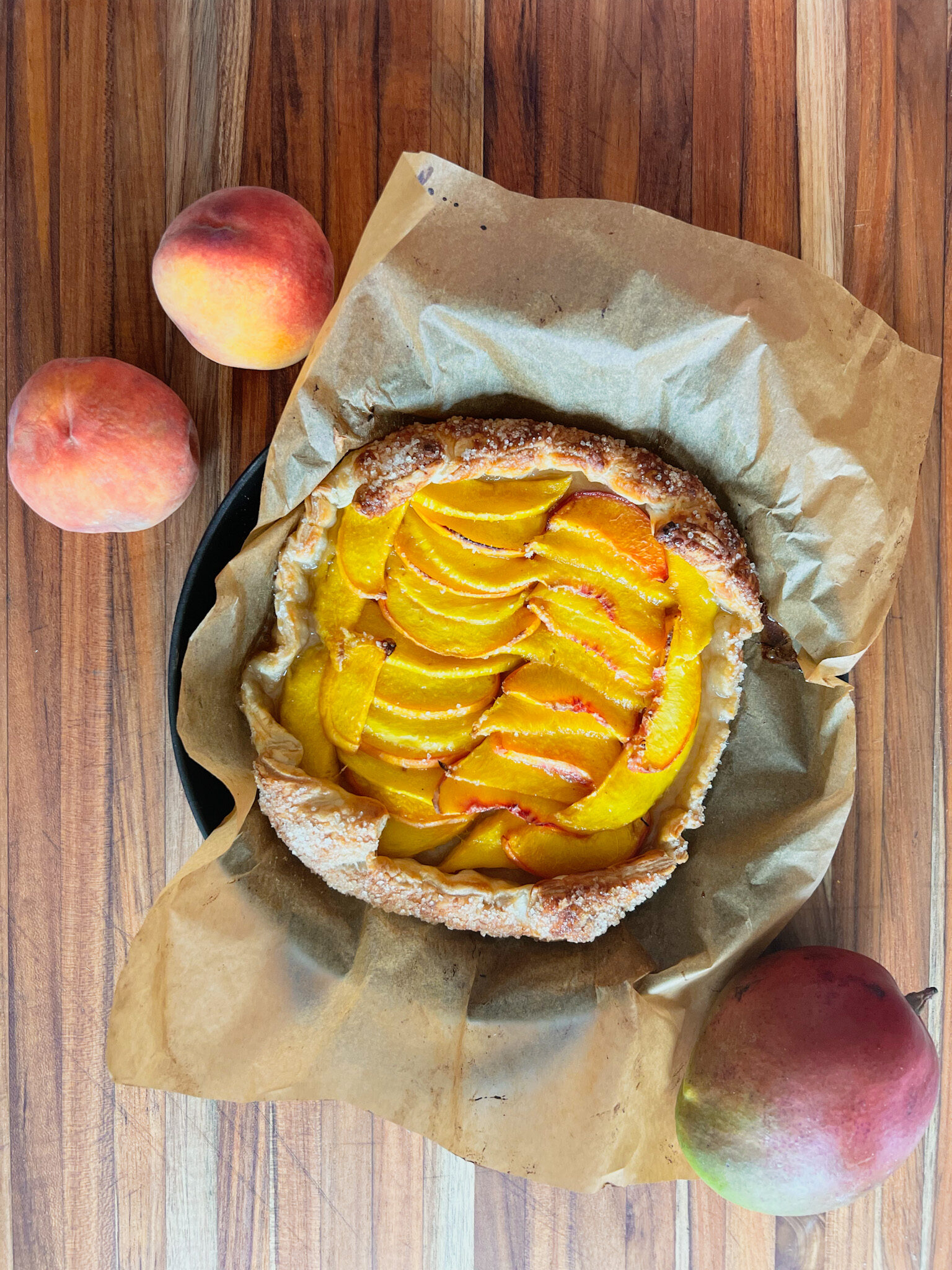 peach mango pie with 2 peaches and one mango