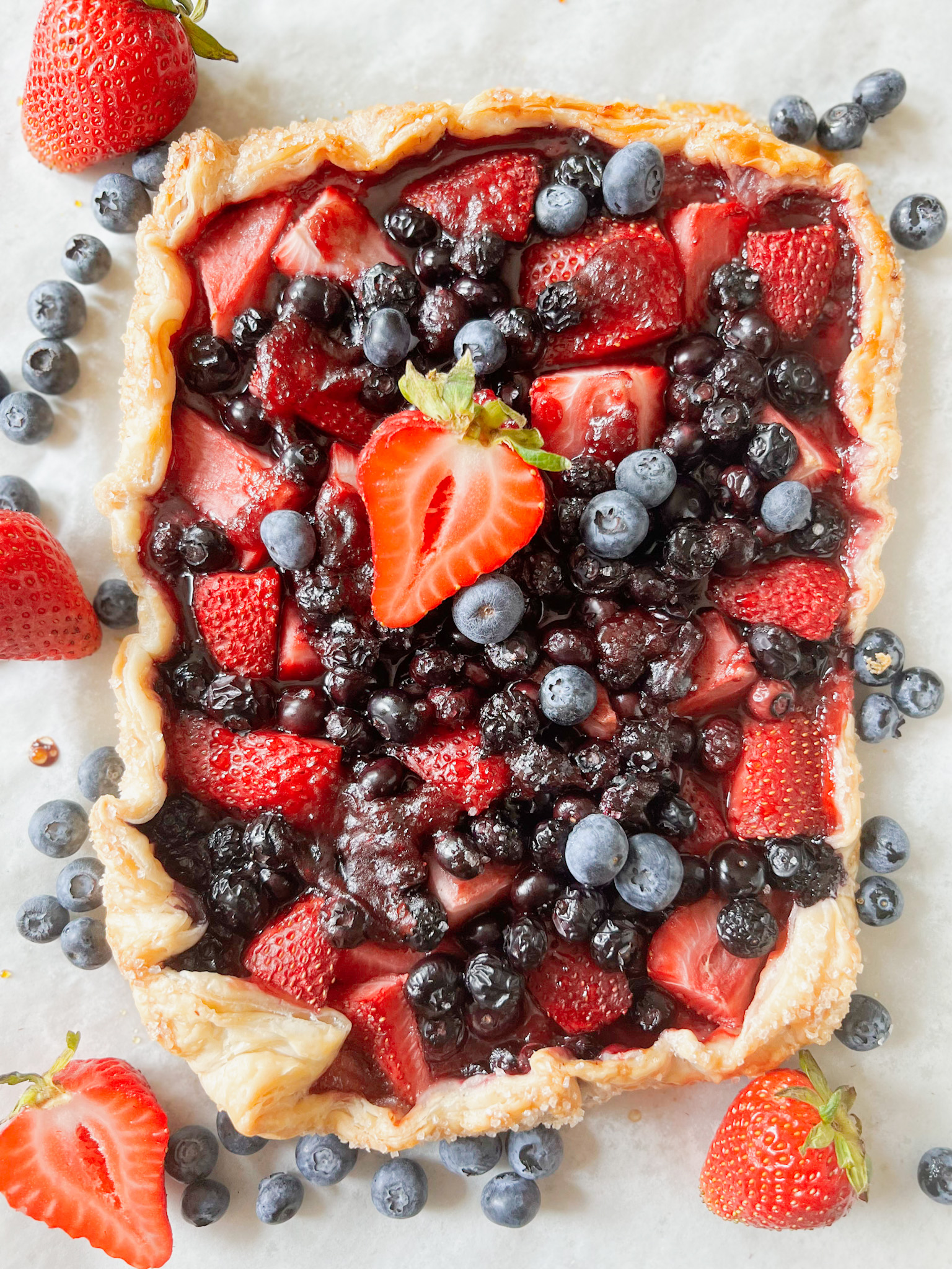 baked vegan fruit tart with blueberries and strawberries