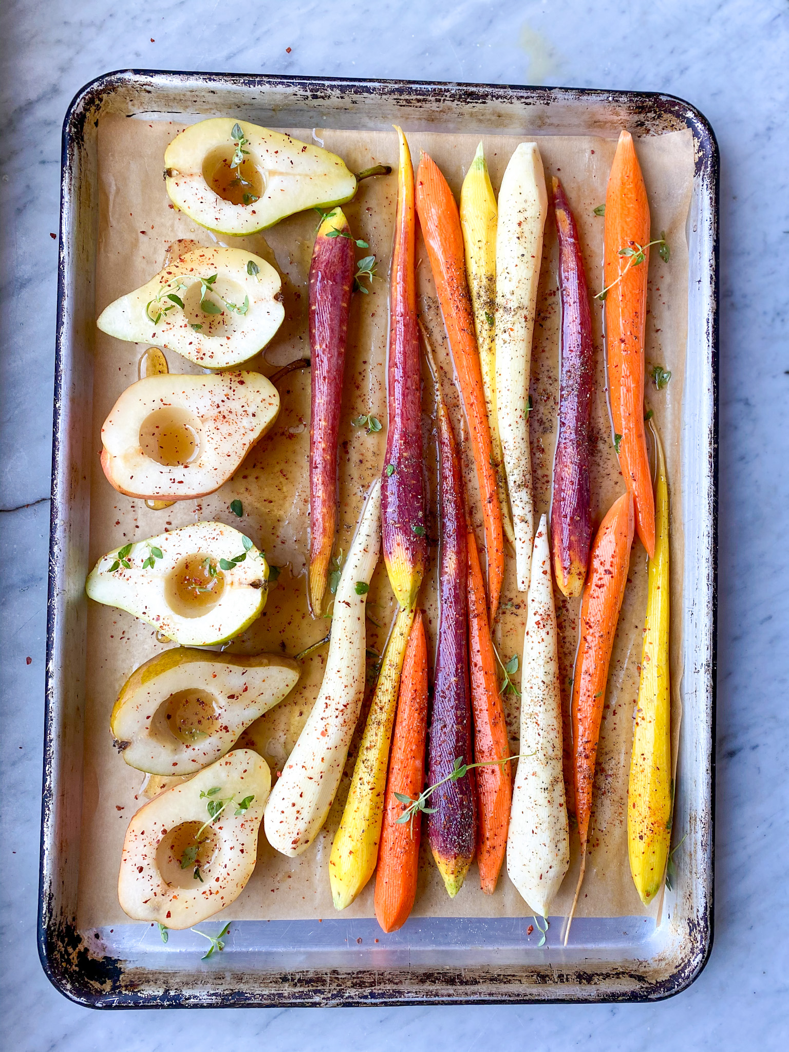 Carrots and pears on sheet pan ready to bake