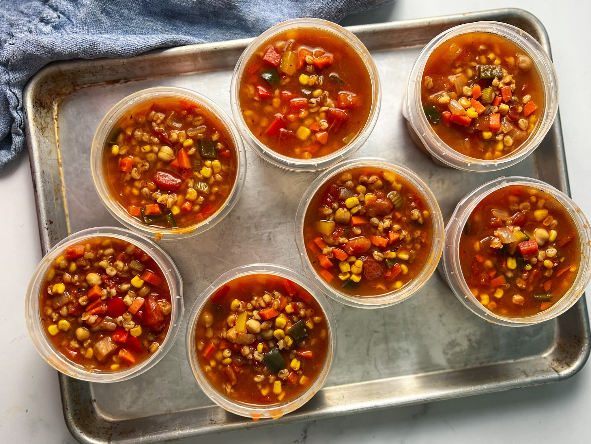 leftover panera 10 vegetable soup in containers on a tray