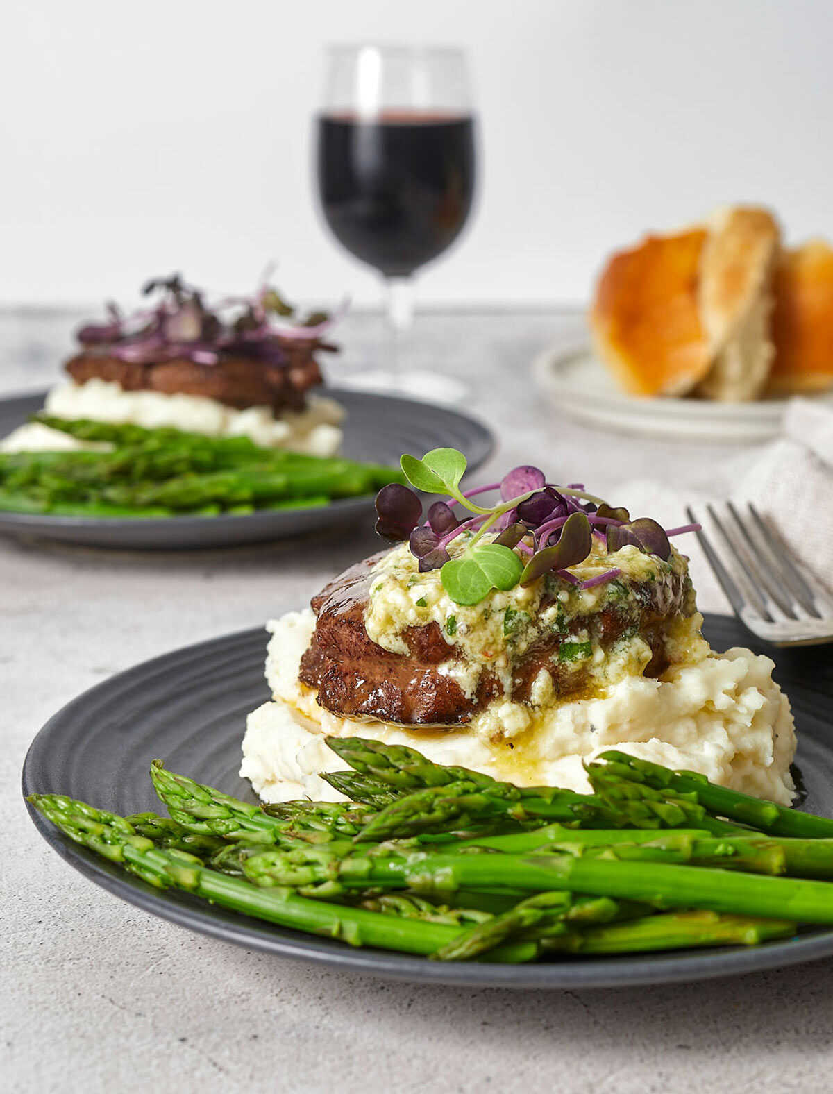 Filet mignon with gorganzola sauce on mashed potatoes with asparagus