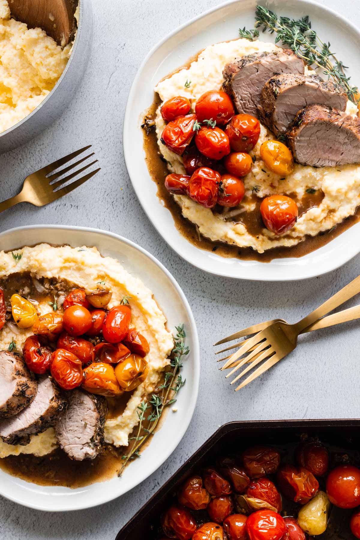 Herb crusted pork tenderloin with creamy polenta and cherry tomatoes
