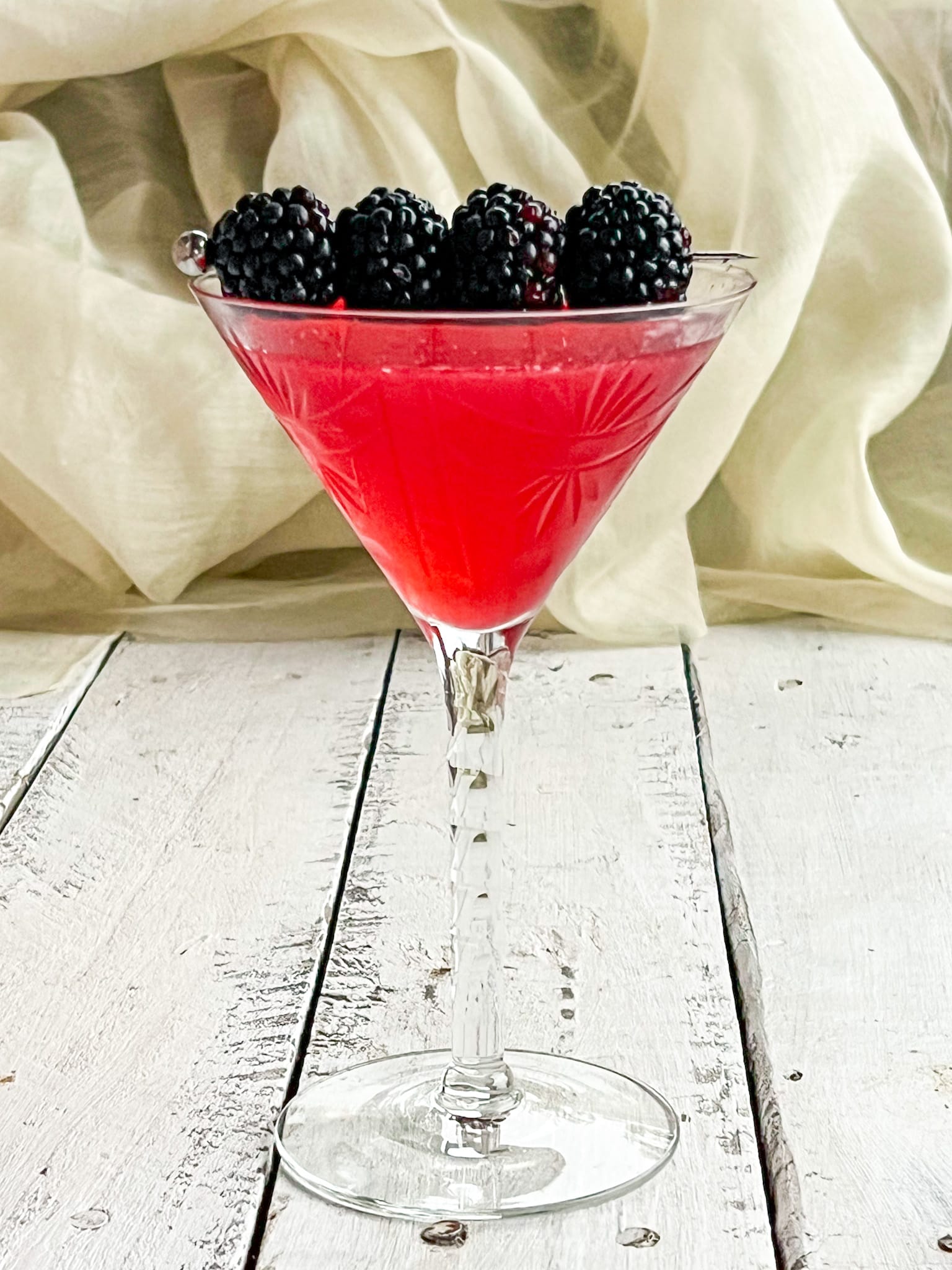 BLACKBERRY martini with blackberry garnish