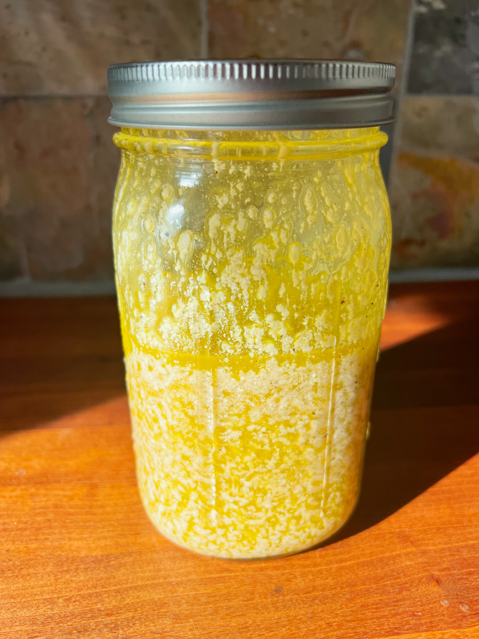 Pasta house salad dressing in a mason jar with a lid on