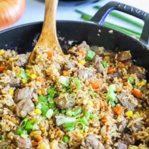 Steak fried rice in a pan with a spoon
