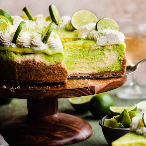 key lime cheesecake with slice out of it