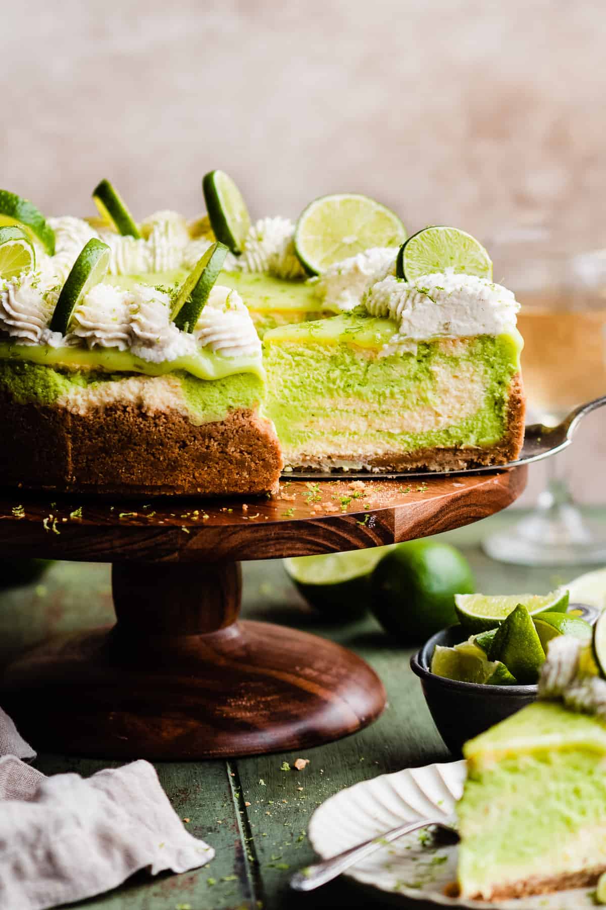 key lime cheesecake with slice out of it