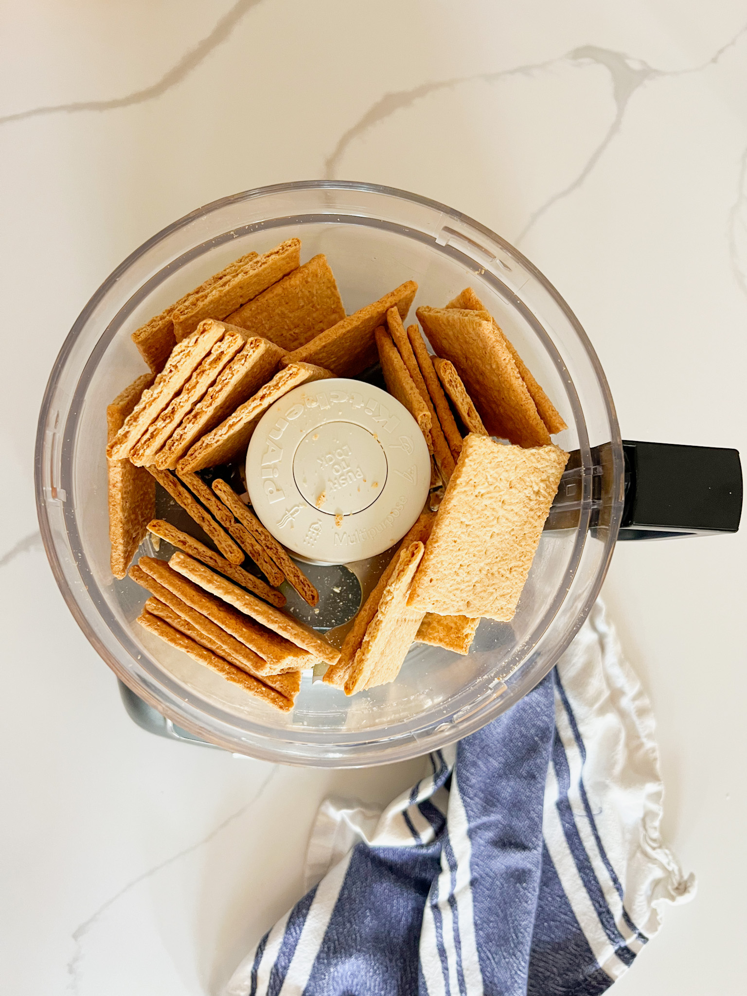 graham crackers in a food processor not yet ground up