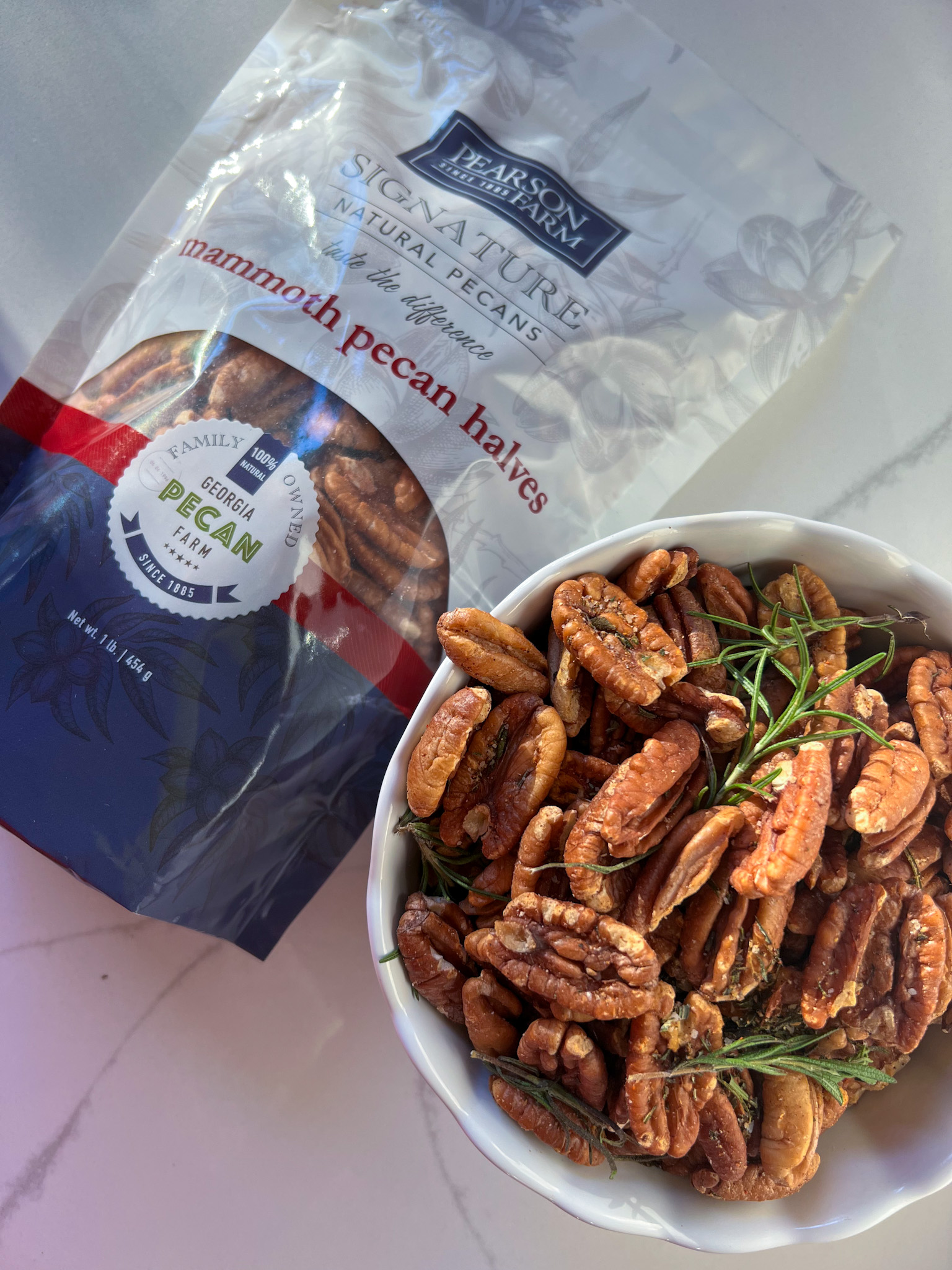 pearson farm mammoth pecans in a bag and a bowl of easy salted roasted pecans with rosemary