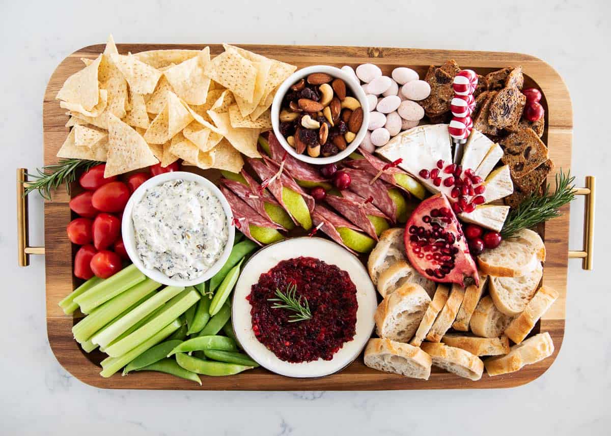 Christmas Charcuterie board with lots of veggies, cheese meats and nuts