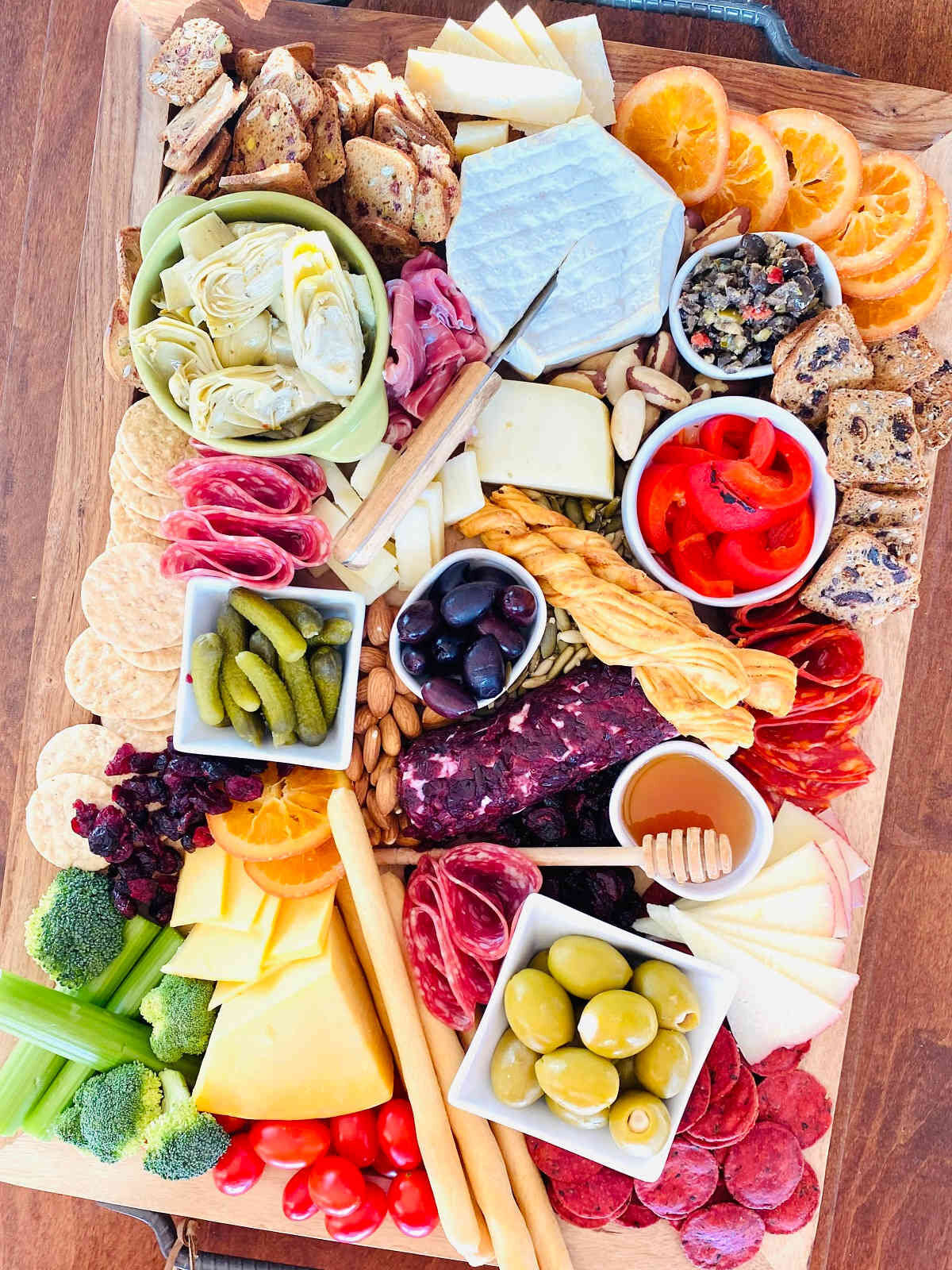 Trader Joe's Charcuterie board with meats cheeses, pickles and olives