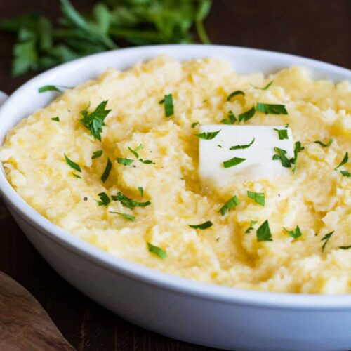 mashed rutabaga in a dish with butter and chives