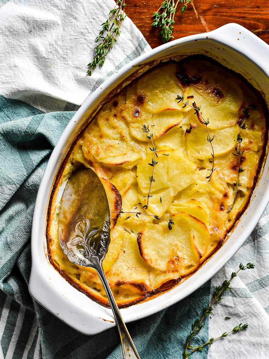 french potato gratin with a serving spoon
