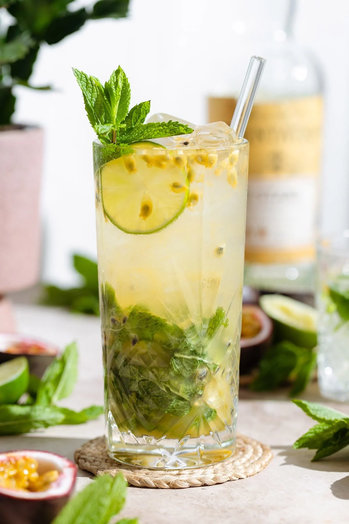 Passion fruit mojito with mint and limes and straw