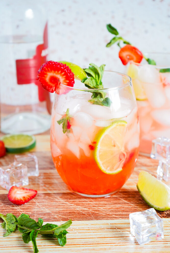 Strawberry lemonade Smash drink with limes and mint