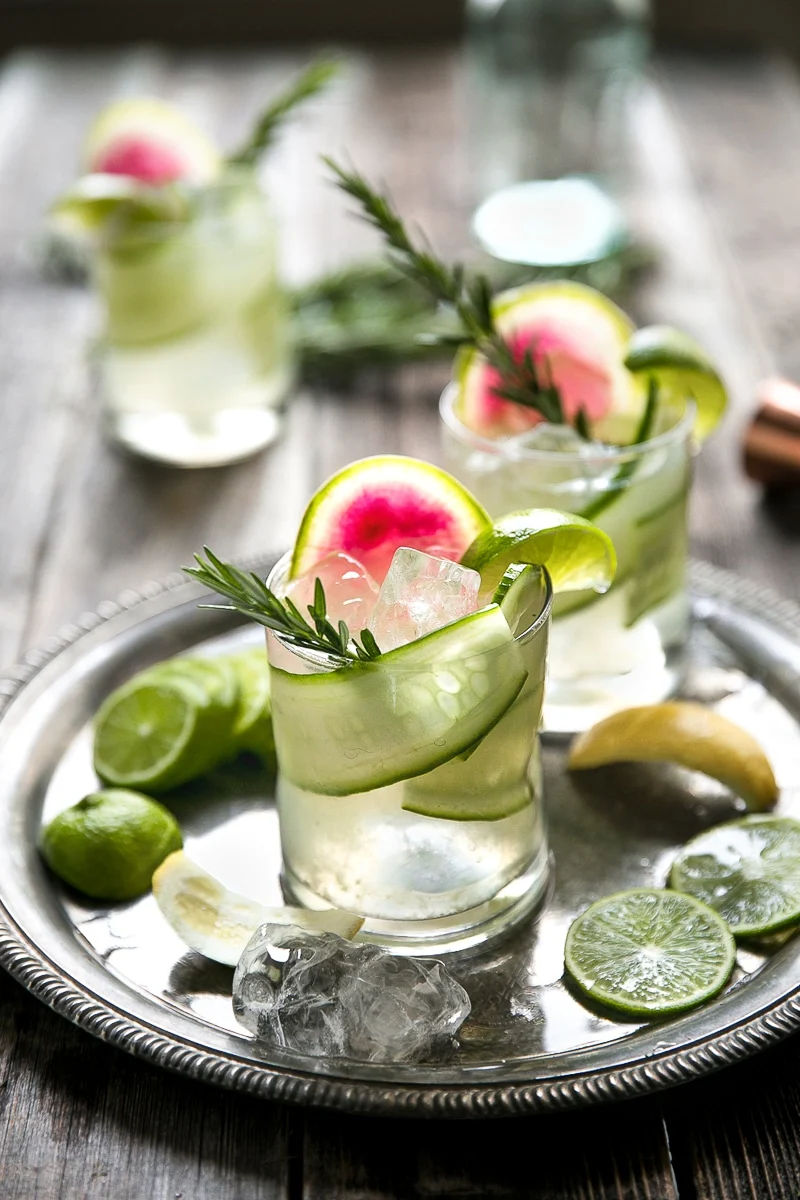 a gin and tonic with cucumber, watermelon and rosemary