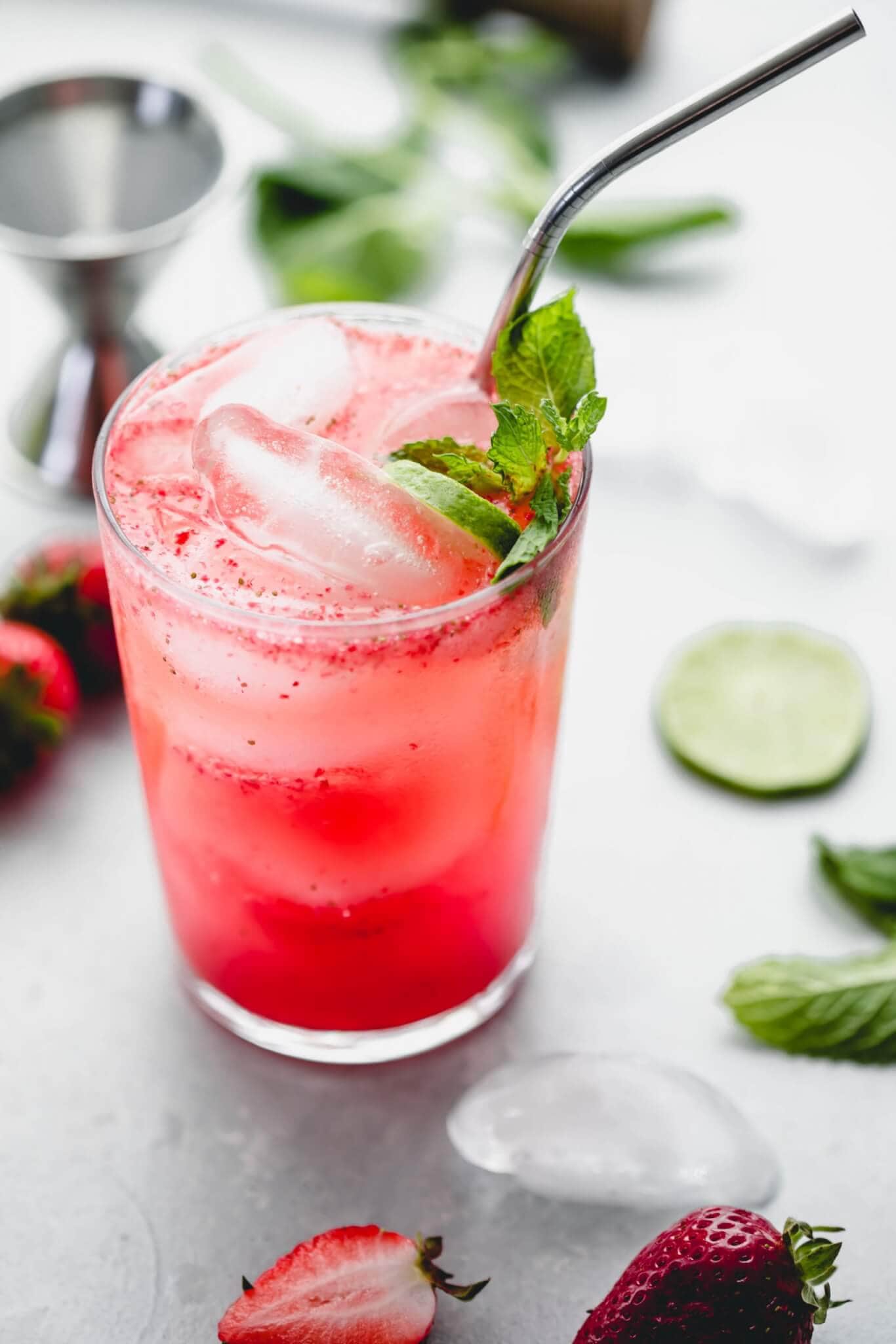 strawberry mojito recipe in a glass with a straw